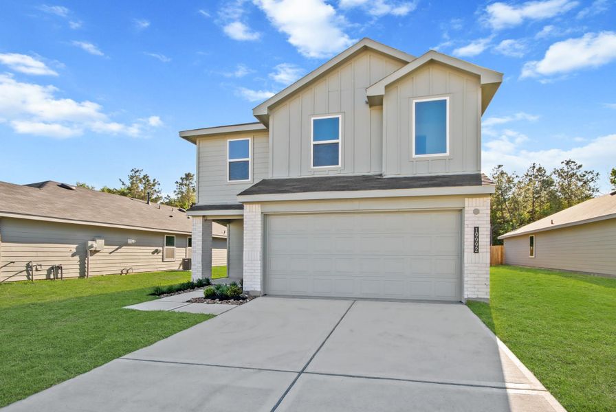 Front exterior of a new home in Porters Mill, New Caney, TX, highlighting curb appeal (Image 19).