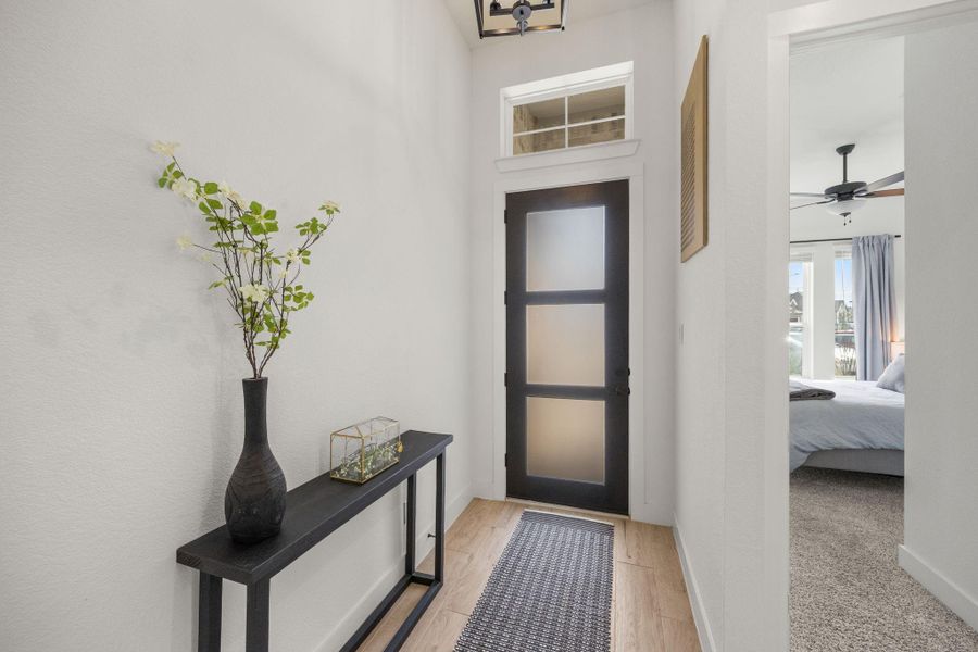 A functional entry corridor with clean lines and modern finishes leads effortlessly toward the main living spaces.