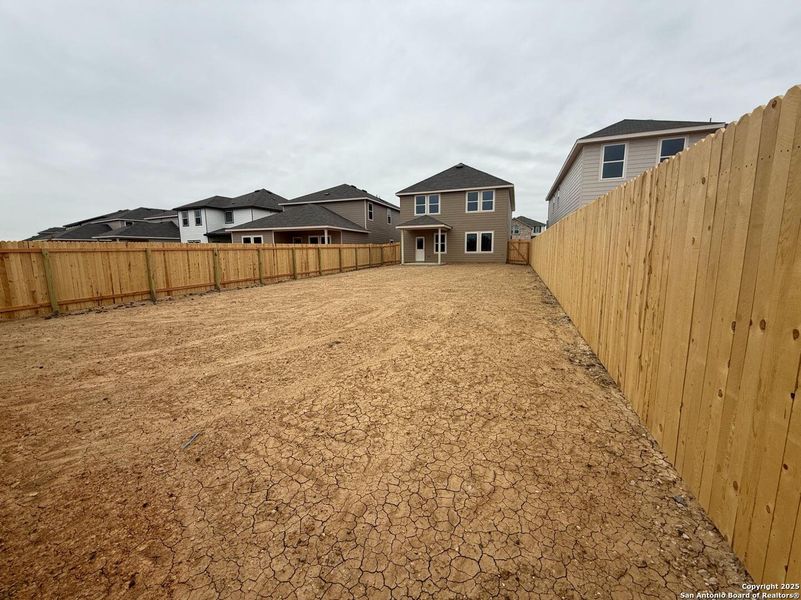 Exterior details and patio area of a home in Meadows at Hennersby Hollow 40's, San Antonio (Image 3).