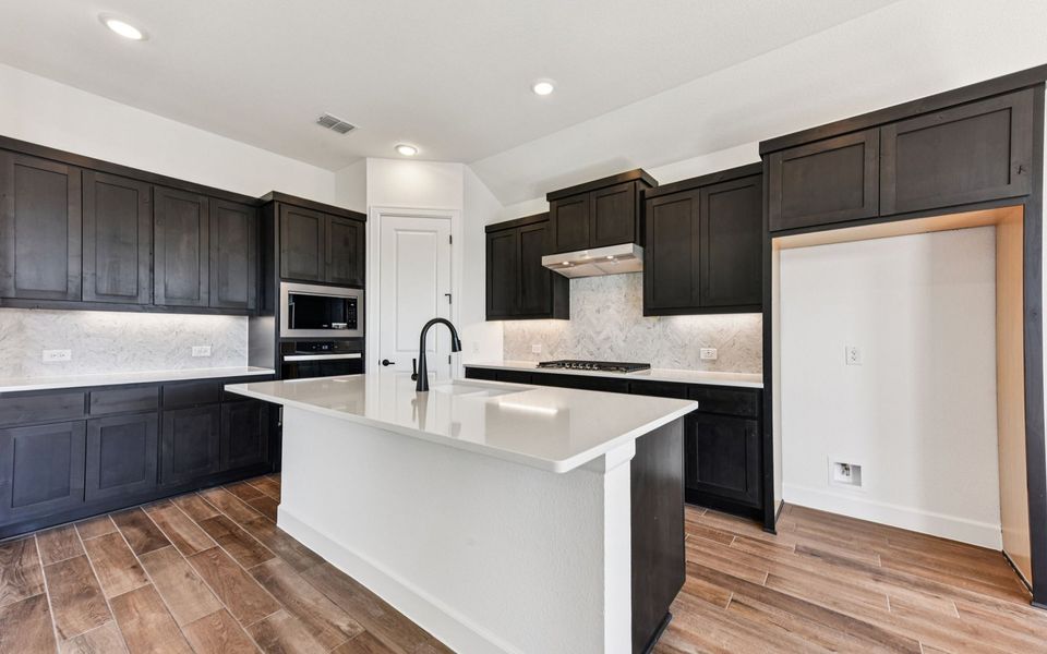 Furnished interior view inside a new home in Kissing Tree, San Marcos (Image 5).