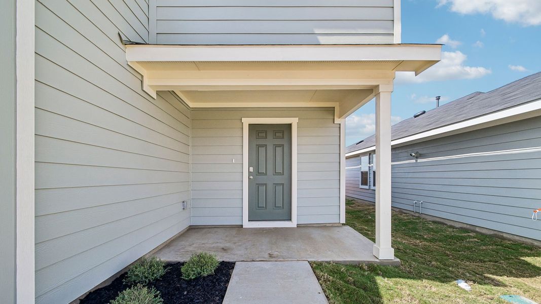 Exterior details and patio area of a home in Prairie Lakes, Buda (Image 3).