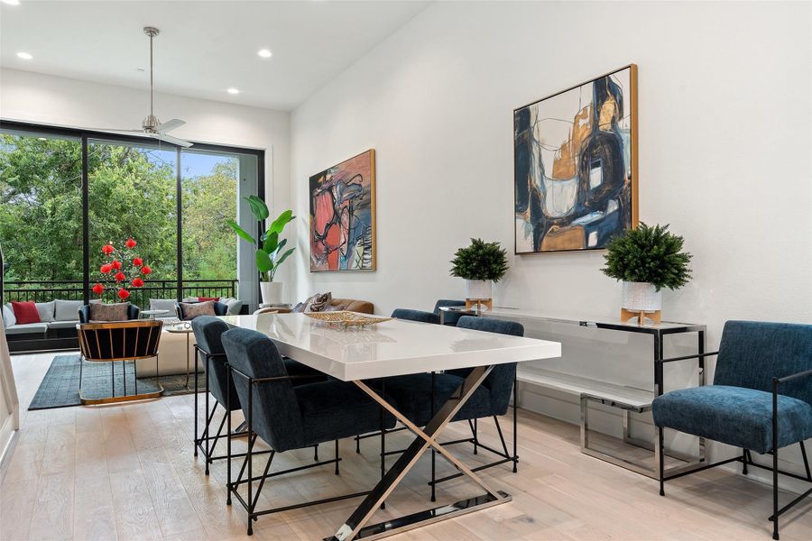 Dining area featuring light wood-style flooring and recessed lighting