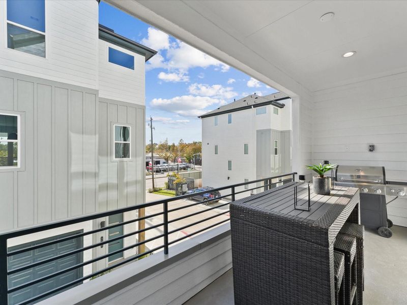 Exterior details and patio area of a home in Reserve At Oak Forest, Houston (Image 17).