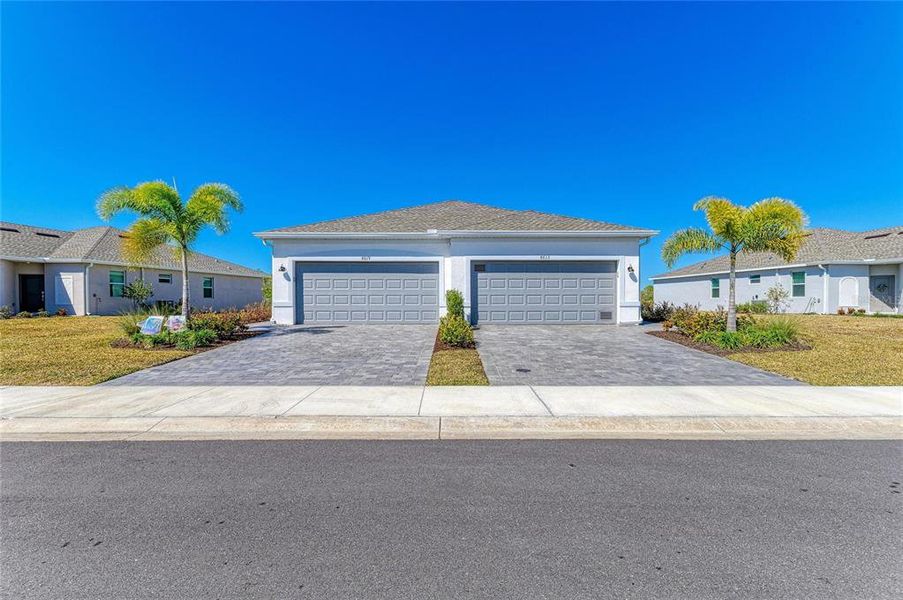 Front exterior of a new home in , Englewood, FL, highlighting curb appeal (Image 2). Front exterior of a new home in , Englewood, FL, highlighting curb appeal (Image 2).