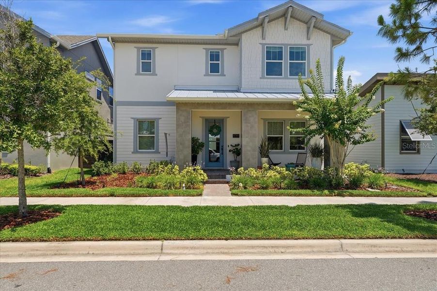 Front exterior of a new home in , Orlando, FL, highlighting curb appeal (Image 1). Front exterior of a new home in , Orlando, FL, highlighting curb appeal (Image 1).