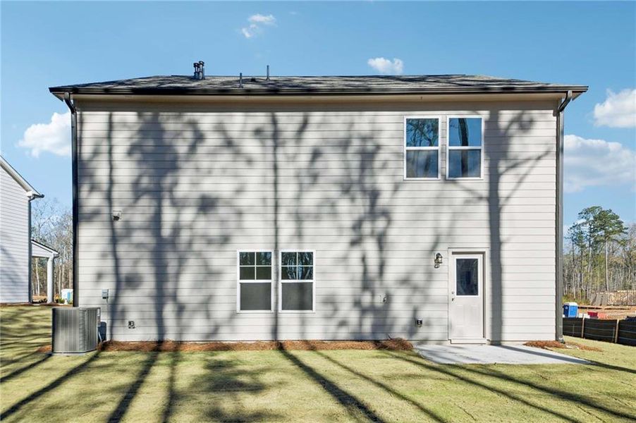Exterior details and patio area of a home in The Pointe at Heron Bay, Locust Grove (Image 21).