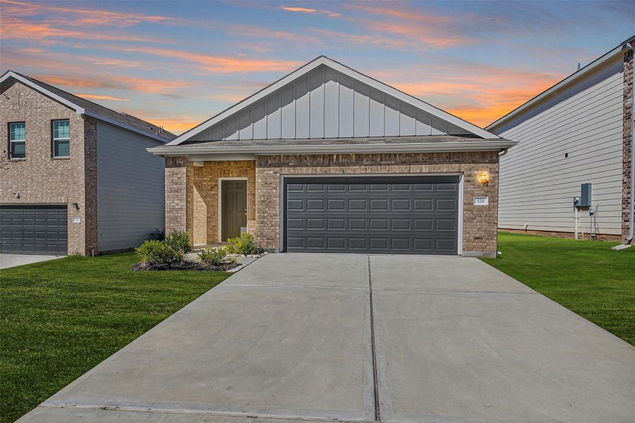 Front exterior of a new home in Chapel Run, Montgomery, TX, highlighting curb appeal (Image 1).