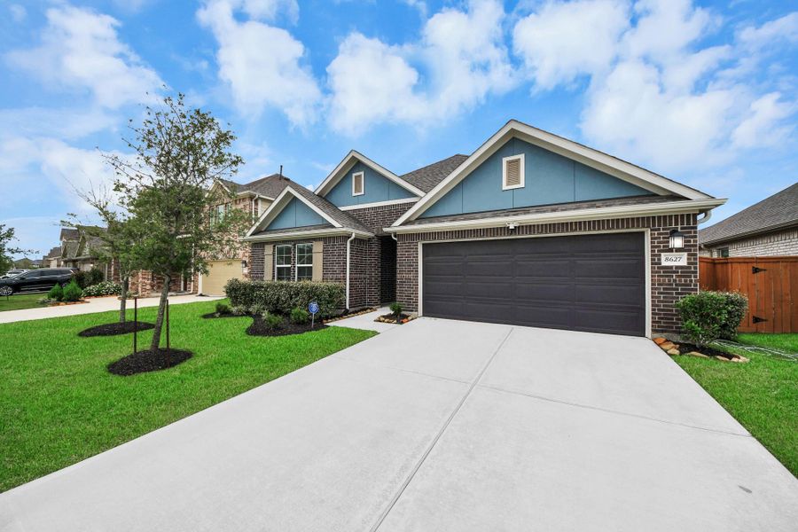 Front exterior of a new home in Marvida, Cypress, TX, highlighting curb appeal (Image 23).