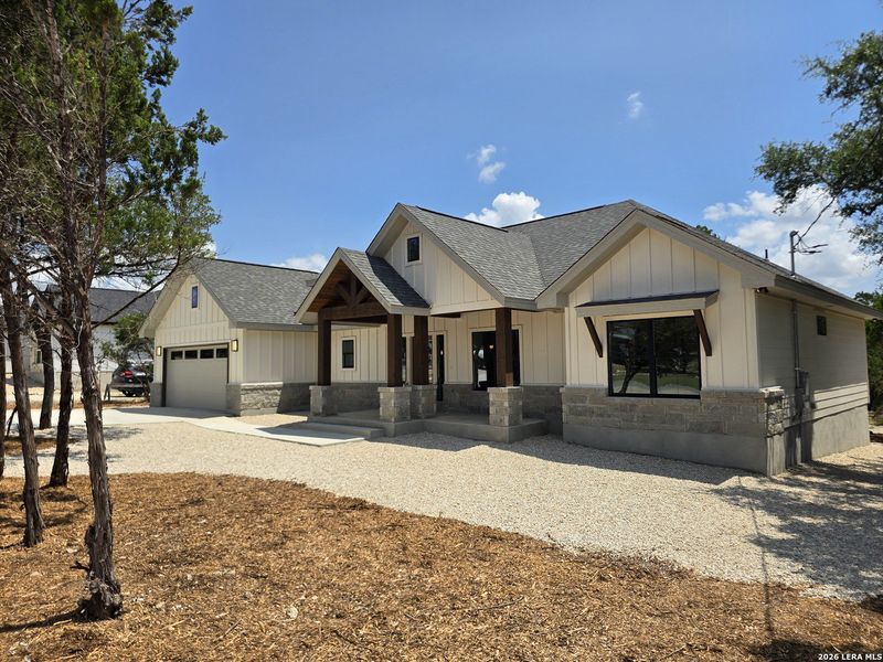 Front exterior of a new home in , Canyon Lake, TX, highlighting curb appeal (Image 30).