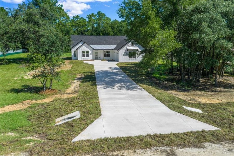 Front exterior of a new home in , Ocala, FL, highlighting curb appeal (Image 27). Front exterior of a new home in , Ocala, FL, highlighting curb appeal (Image 27).