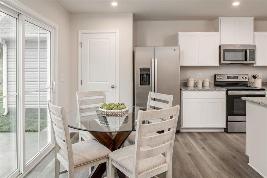 Representative furnished interior of a home built from the Tate by Ryan Homes in Middle Creek Village Coastal Cottages & Villas, Bolivia (Image 14).
