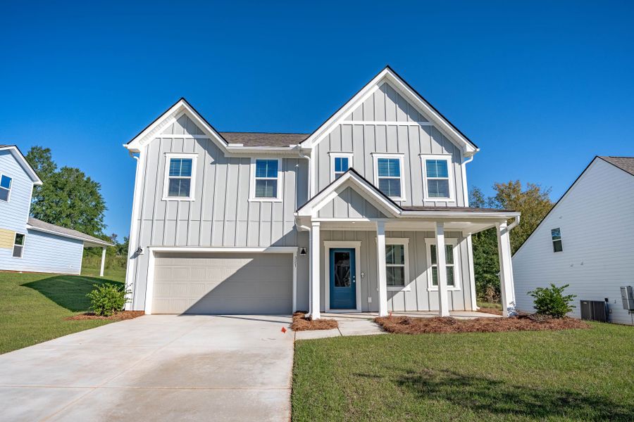 Front exterior of a new home in Carriage Estates, Lexington, SC, highlighting curb appeal (Image 21). Front exterior of a new home in Carriage Estates, Lexington, SC, highlighting curb appeal (Image 21).