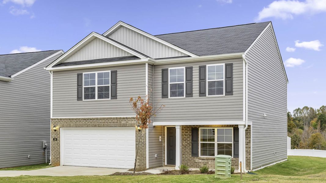 Front exterior of a new home in Hudson Glen, Mocksville, NC, highlighting curb appeal (Image 2). Front exterior of a new home in Hudson Glen, Mocksville, NC, highlighting curb appeal (Image 2).