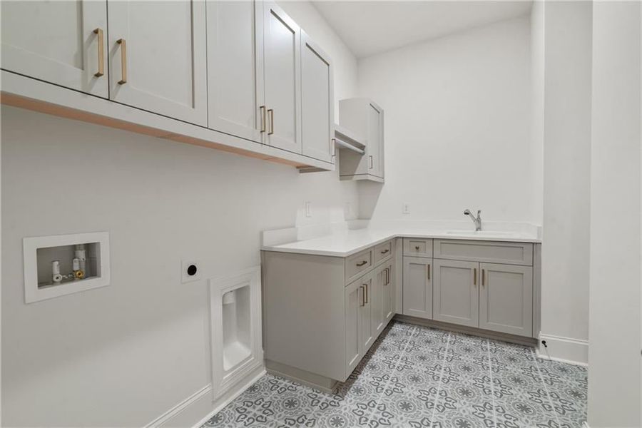 Just off the owners closet is this amazing laundry room!
