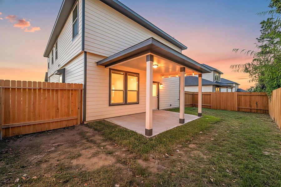 Enjoy outdoor living on the covered patio overlooking the fenced backyard—perfect for relaxing evenings or weekend gatherings. This private space offers plenty of room to play, garden, or entertain.