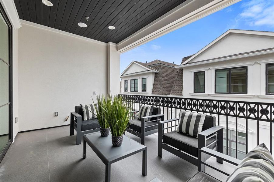 Ready for entertaining, this covered terrace is complete with pre-wiring for television system and speakers, gas output and water hookups. The perfect place to grill! Image of a previously completed home in the community.