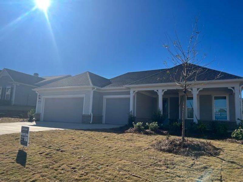 Front exterior of a new home in Del Webb at Lake Oconee, Greensboro, GA, highlighting curb appeal (Image 1). Front exterior of a new home in Del Webb at Lake Oconee, Greensboro, GA, highlighting curb appeal (Image 1).