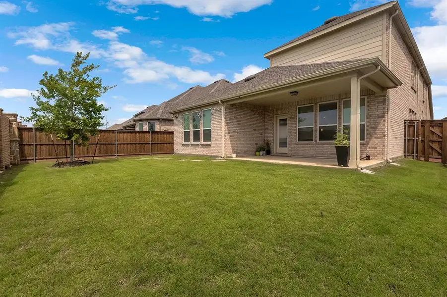 Exterior details and patio area of a home in , Little Elm (Image 4). Exterior details and patio area of a home in , Little Elm (Image 4).