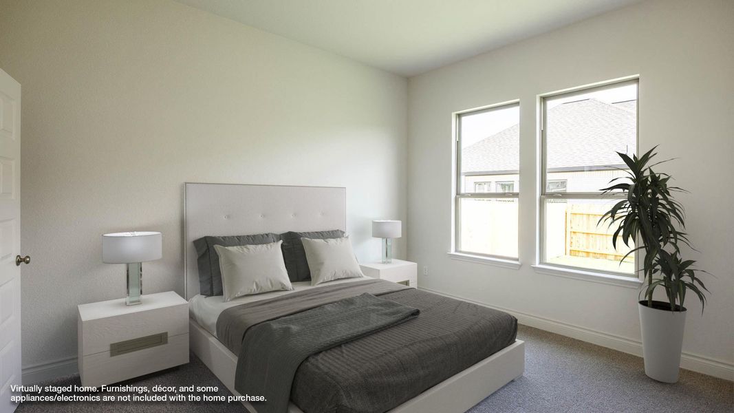 Carpeted bedroom featuring baseboards Carpeted bedroom featuring baseboards