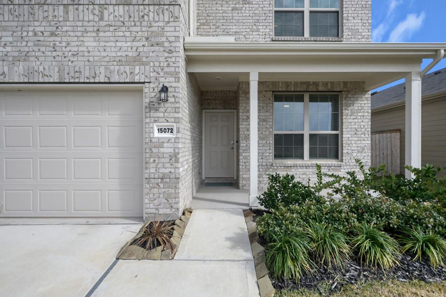 Exterior details and patio area of a home in Mavera, Conroe (Image 29).