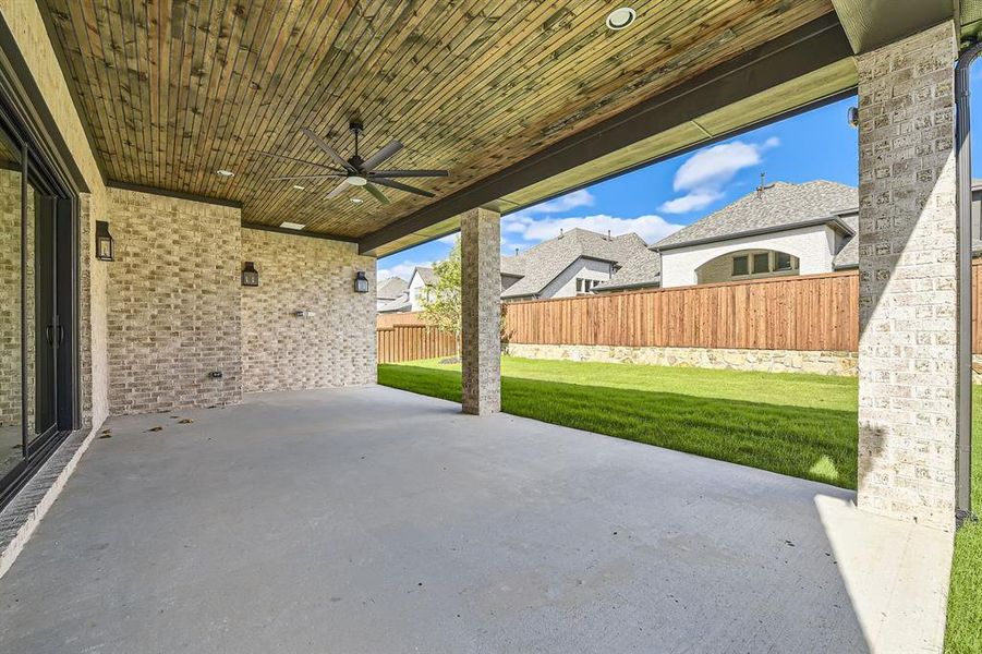 View of patio featuring ceiling fan