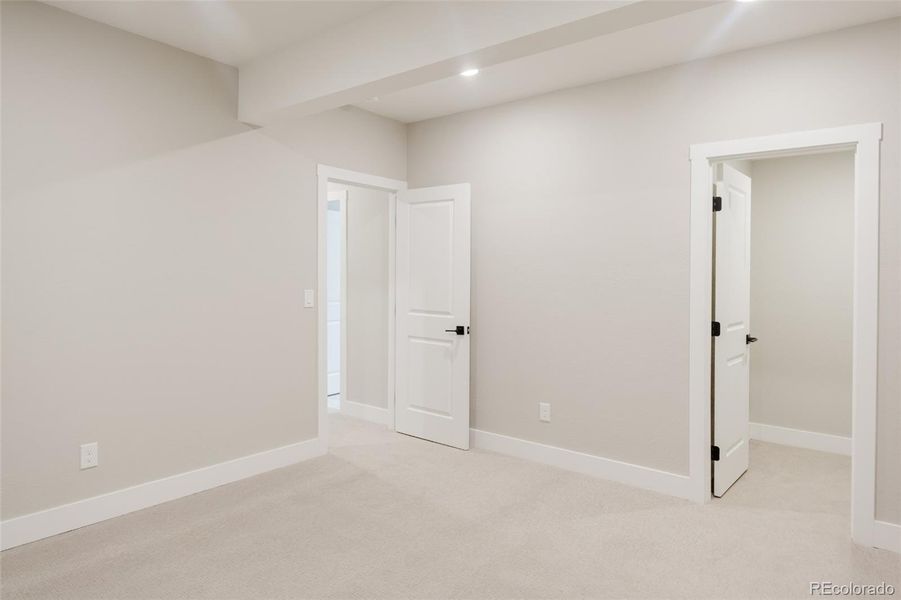 The fourth bedroom is located on the basement level and has a walk-in closet. The fourth bedroom is located on the basement level and has a walk-in closet.