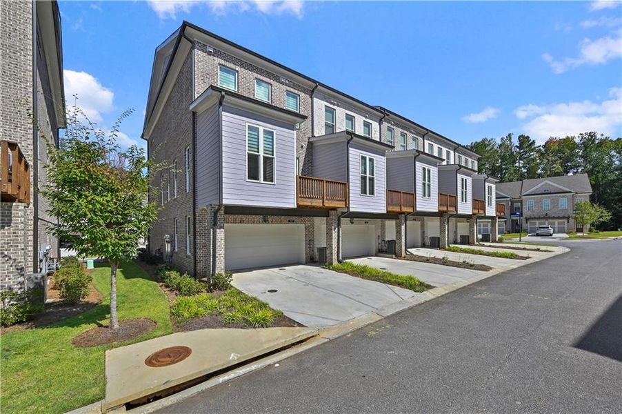 Front exterior of a new home in , Johns Creek, GA, highlighting curb appeal (Image 20).