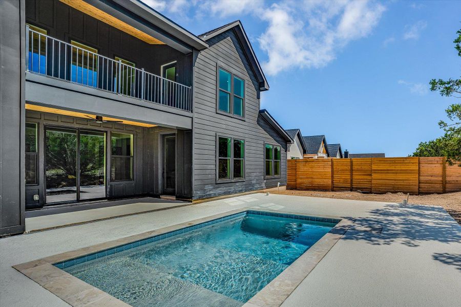 A tranquil swimming pool awaits, perfectly complementing the modern architecture of this inviting dwelling.