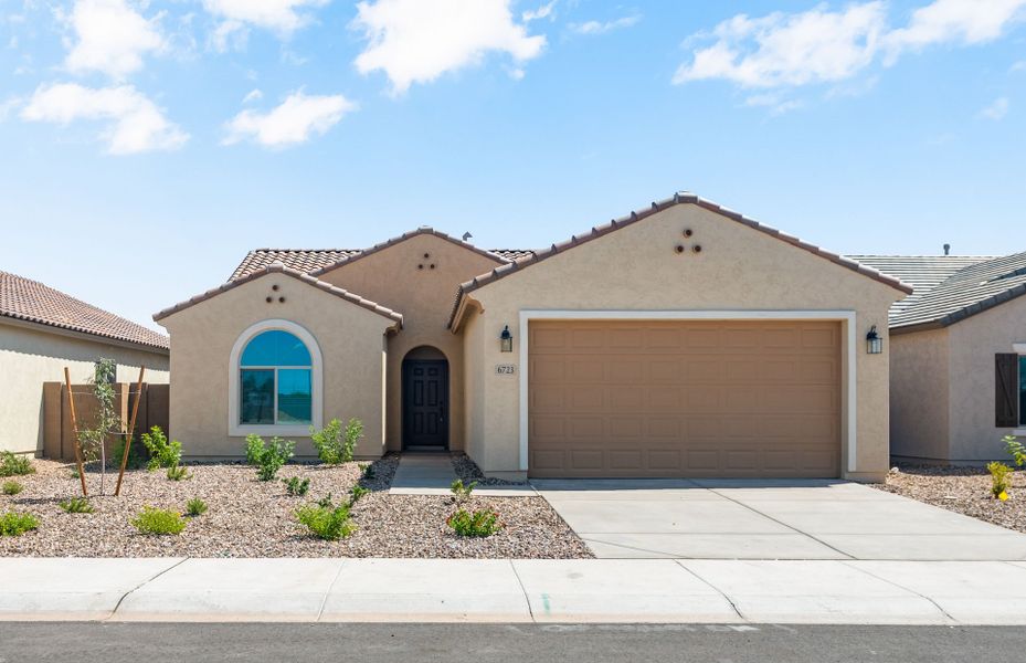 Front exterior of a new home in Parkside at Anthem at Merrill Ranch, Florence, AZ, highlighting curb appeal (Image 2). Front exterior of a new home in Parkside at Anthem at Merrill Ranch, Florence, AZ, highlighting curb appeal (Image 2).