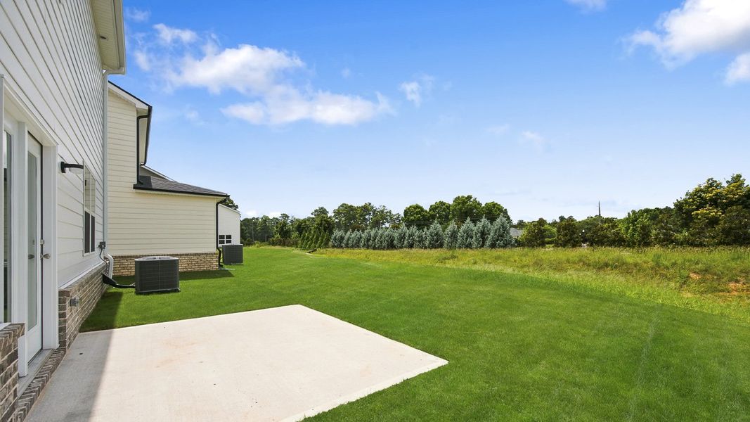 Exterior details and patio area of a home in Shoal Creek, Hampton (Image 2).
