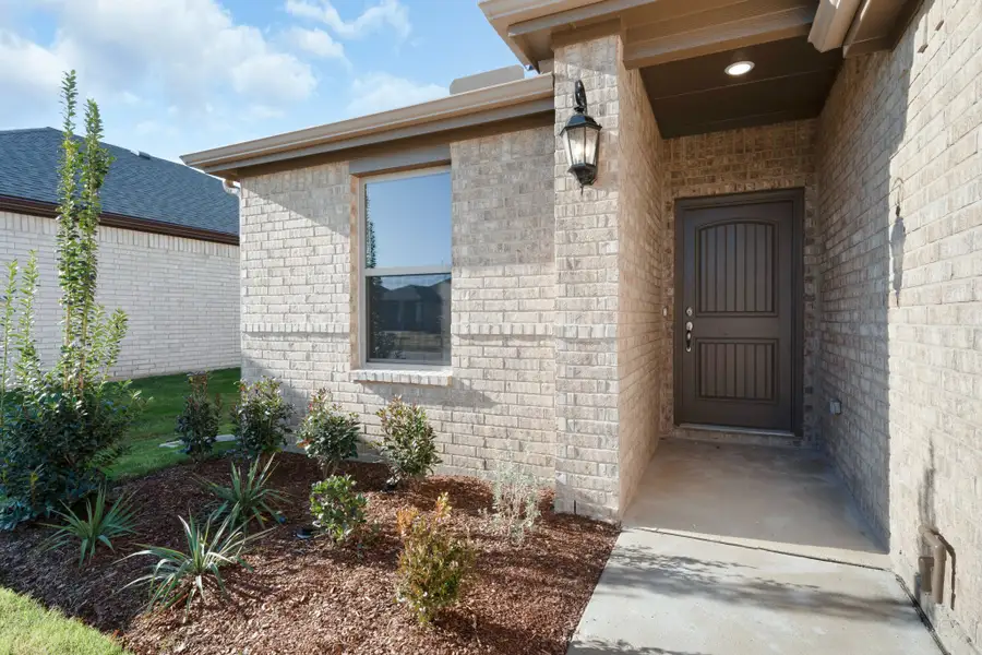 Exterior details and patio area of a home in Stonecreek, Sulphur Springs (Image 3).