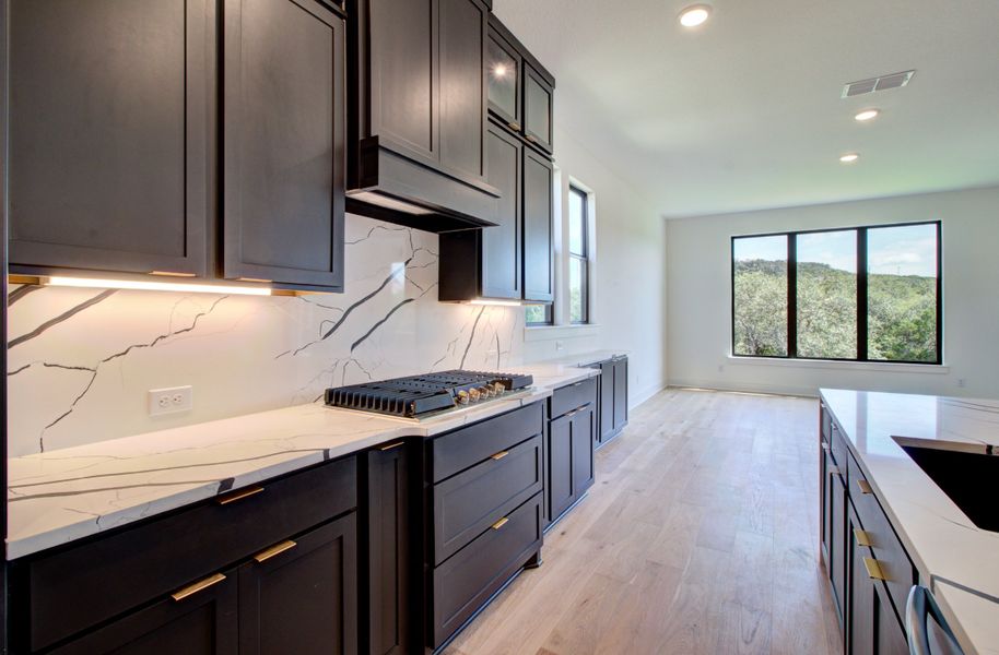 Representative furnished interior of a home built from the Signature Series - Partridge by DRB Homes in Oaks at San Gabriel, Georgetown (Image 5). Representative furnished interior of a home built from the Signature Series - Partridge by DRB Homes in Oaks at San Gabriel, Georgetown (Image 5).