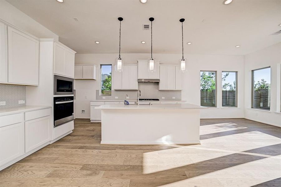 View of the modern kitchen from the living space.