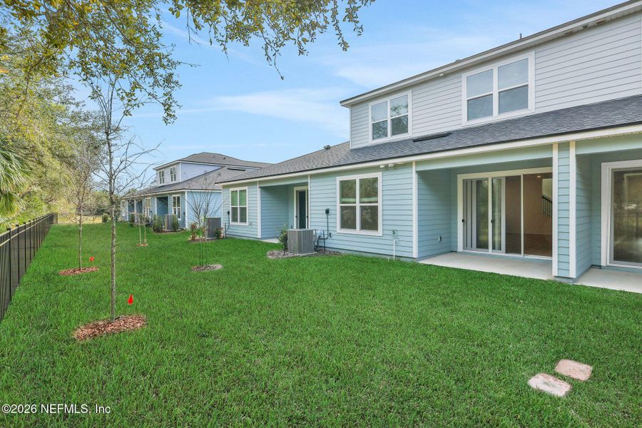 Exterior details and patio area of a home in The Hammock at Palm Harbor, Palm Coast (Image 4).