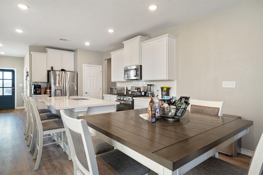 Open dinning and kitchen areas.