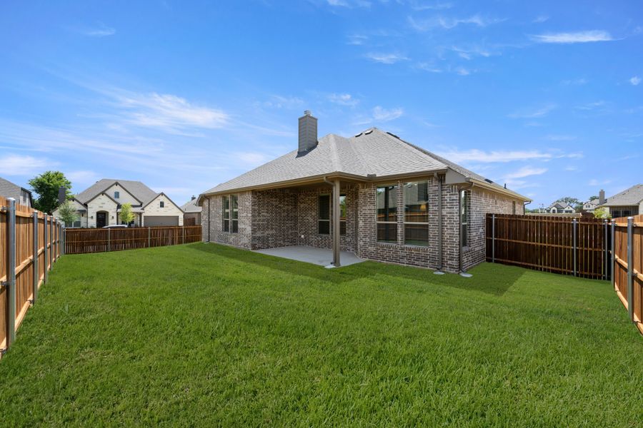 Exterior details and patio area of a home in Mockingbird Hills - Signature Series, Joshua (Image 19).