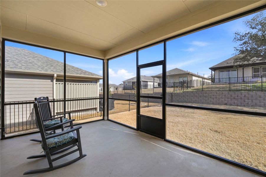 Unfurnished sunroom featuring a residential view