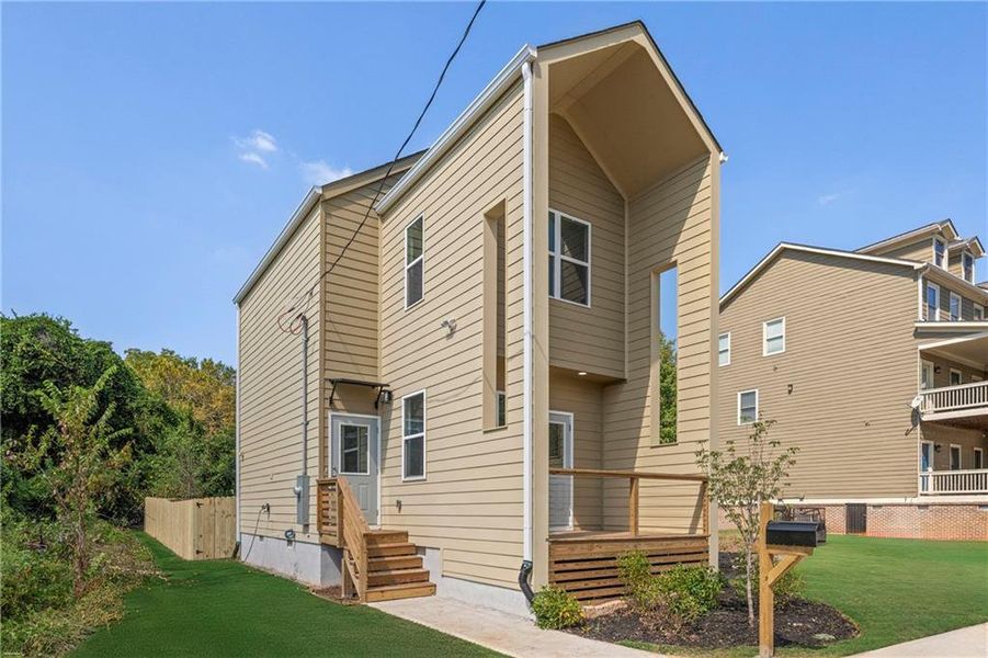 Front exterior of a new home in , Atlanta, GA, highlighting curb appeal (Image 15).