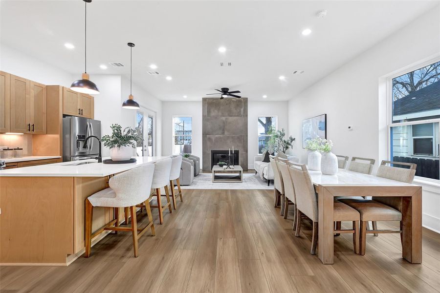 Open-concept living, dining, and kitchen area with modern finishes and abundant natural light.