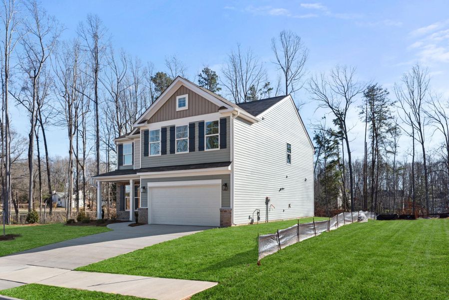 Front exterior of a new home in Chandler Ridge, McLeansville, NC, highlighting curb appeal (Image 2).