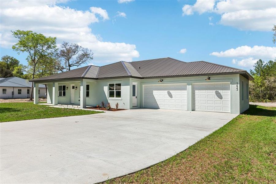 Front exterior of a new home in , Deland, FL, highlighting curb appeal (Image 2). Front exterior of a new home in , Deland, FL, highlighting curb appeal (Image 2).