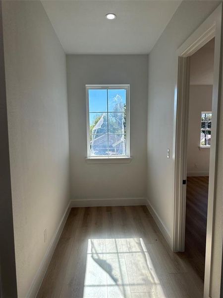 Unfurnished room featuring light wood-type flooring