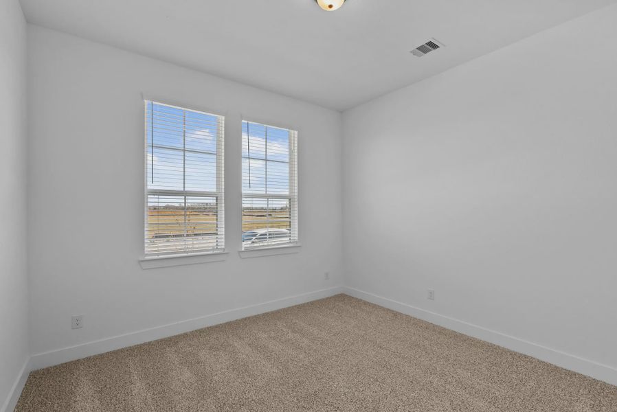 Representative unfurnished interior of a home built from the Nicklaus by Chesmar Homes in Riceland Alley Loads, Mont Belvieu (Image 29).