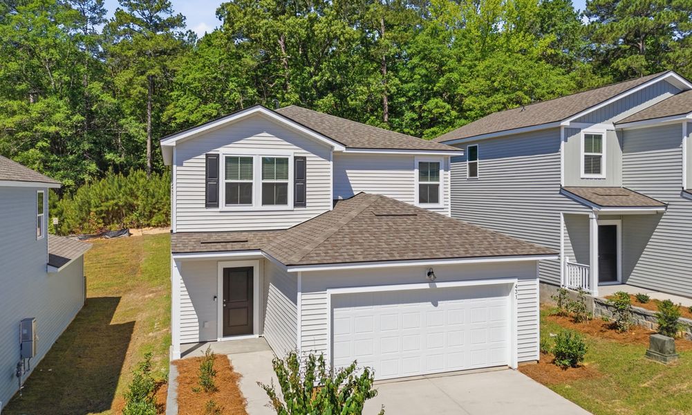 Front exterior of a new home in Grand Arbor, Blythewood, SC, highlighting curb appeal (Image 17).