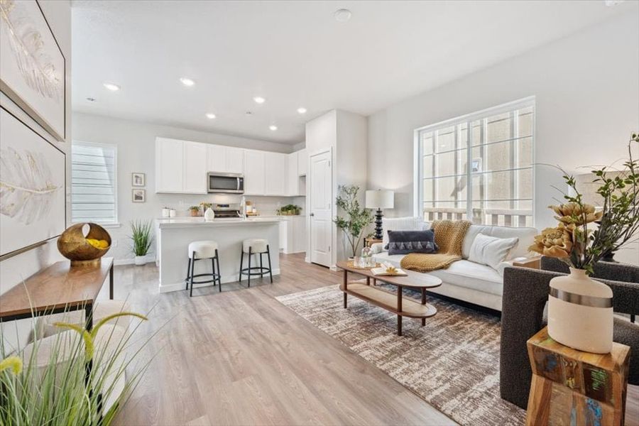 A living room with a wood floor. A living room with a wood floor.