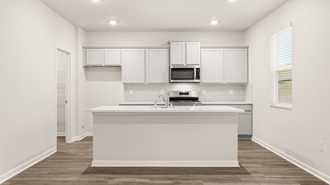 Representative furnished interior of a home built from the Galen by D.R. Horton in Champion's Run, Lithonia (Image 4).