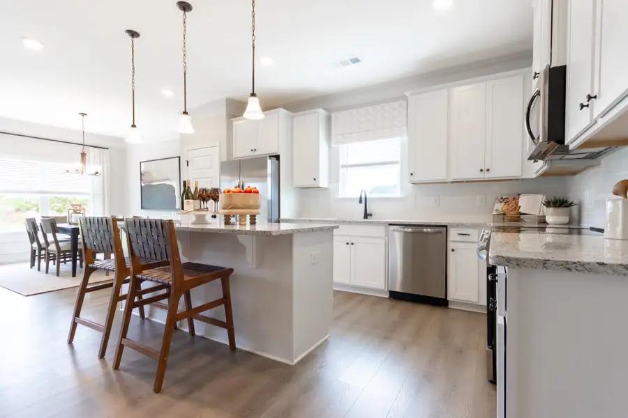 Bradley F with Bonus at Cobblestone Crossing Commons | Kitchen Island and Dining Area Bradley F with Bonus at Cobblestone Crossing Commons | Kitchen Island and Dining Area
