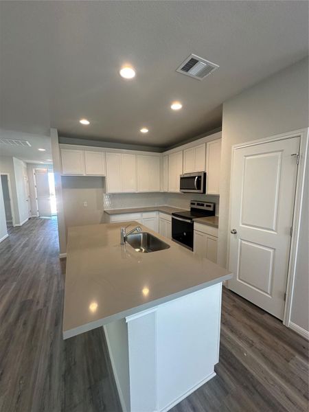 Beautifully appointed Open Concept Kitchen - Virtually Staged