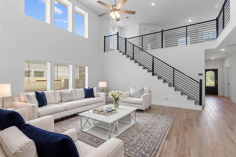 Virtually staged to showcase the stunning design possibilities! Soaring two-story entry with sleek modern cable iron railing and upgraded wood-look tile flooring creates a dramatic first impression—style meets function in every corner. Virtually staged to showcase the stunning design possibilities! Soaring two-story entry with sleek modern cable iron railing and upgraded wood-look tile flooring creates a dramatic first impression—style meets function in every corner.