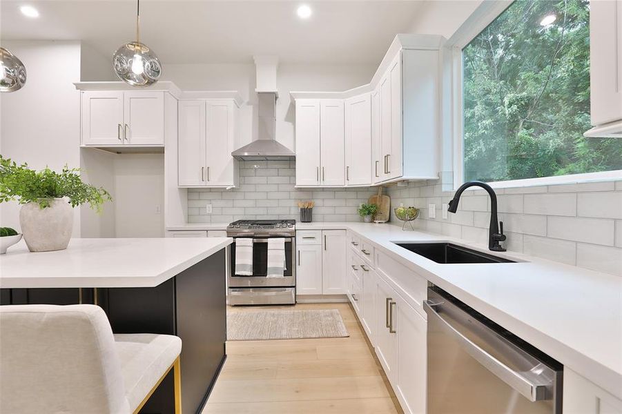 Experience culinary excellence in this kitchen, featuring abundant 42-inch cabinetry and a sleek glass tile backsplash, all designed to inspire your inner chef.